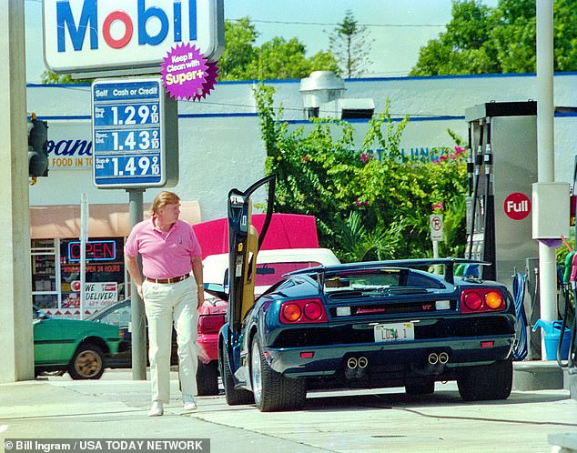 Donald Trump's famous custom-ordered Lamborghini Diablo VT Roadster is one of only 132 produced for the US and the only one personalized in this blue paint color.  In the photo: Trump in 1995 with a similar car