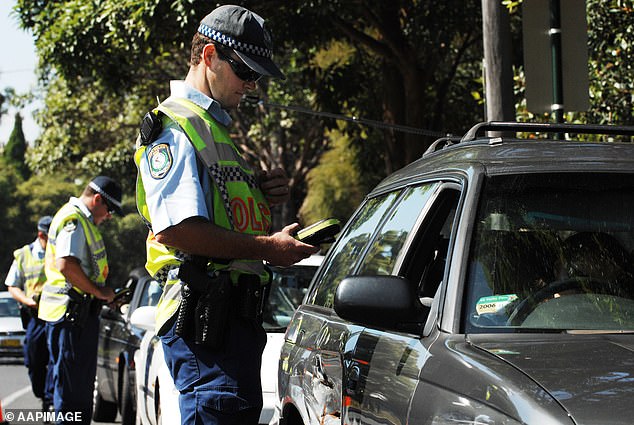 Drivers are being warned to drive carefully over the Australia Day long weekend, with double demerit points applicable.  NSW Police officers are pictured talking to drivers