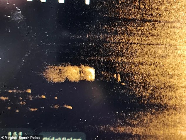 A sonar image from Virginia Beach police shows the car on its roof, lying in 20 feet of water