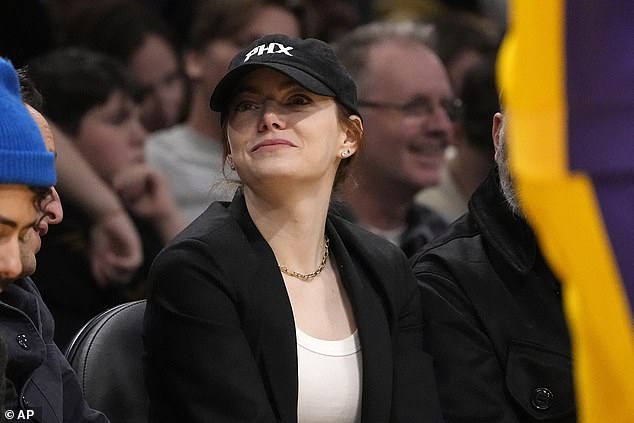 Emma Stone, 35, cut a relaxed figure as she enjoyed a night out at the LA Lakers' game against the Phoenix Suns, following her success at the Golden Globes on Sunday