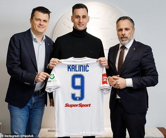 Nikola Kalinic poses with the number 9 shirt after rejoining his boyhood club Hajduk Split