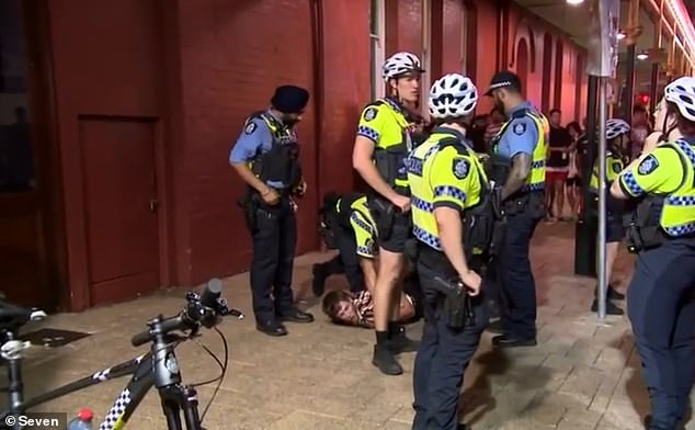 The man (pictured on the ground) at the center of a shocking video of a police officer punching him repeatedly says it was caused by a misunderstanding