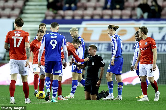 A fan was called in to help out at a League One match on Tuesday evening after referee Adam Herczeg suffered a nasty head injury