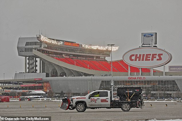 A plow driver patrols the parking lot of Arrowhead Stadium in Kansas City amid a snowstorm