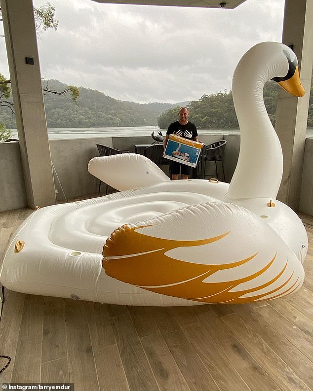 Fans have noticed a wild detail in a photo of Larry Emdur with a giant inflatable swan... and it's not the bird