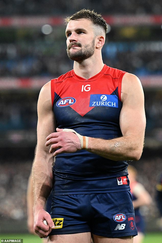 Joel Smith (pictured after Melbourne's loss to Carlton in last year's final series) faces a ban of at least two years if he is found to have used cocaine as a performance-enhancing drug last season.