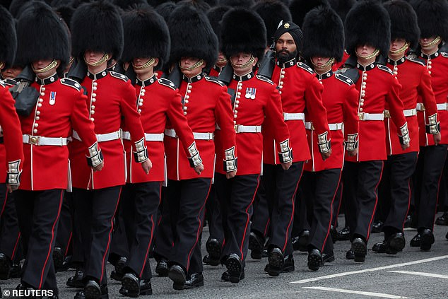 Grenadier Guards march through the streets in front of Big Ben in Westminster on the day of the coronation of British King Charles in London, Great Britain, May 6, 2023