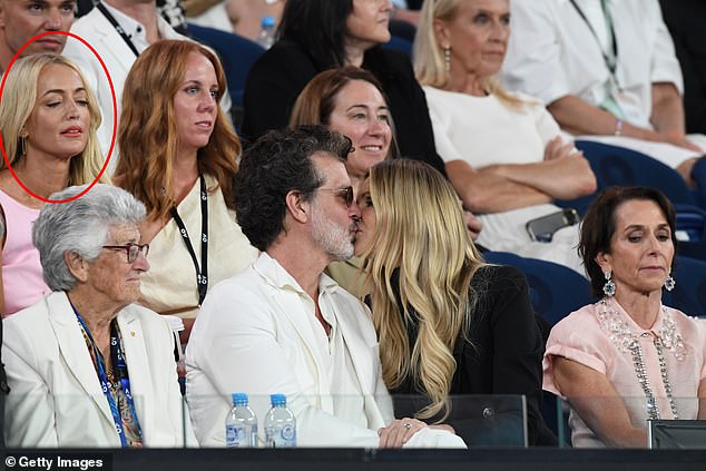 Jackie 'O' Henderson got more than she bargained for when she attended the Australian Open on Thursday night.  While the Sydney radio titan was in Melbourne to attend the women's semi-final, she was also treated to an amorous display off court from Elle Macpherson and her boyfriend Doyle Bramhall.  All depicted