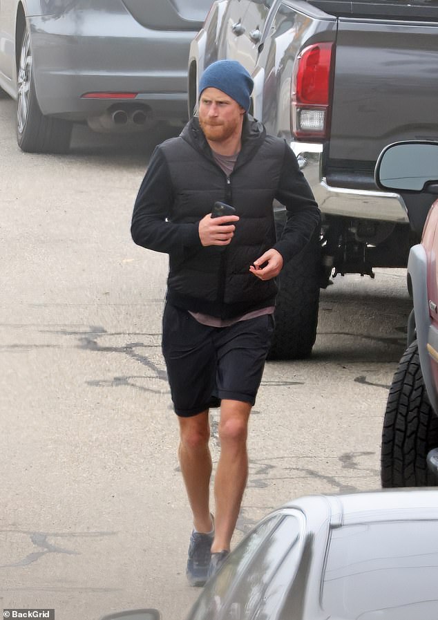 In California's crisp January weather, Prince Harry was spotted jogging in a black jacket and matching shorts, apparently with a frowning, serious expression on his face, as he left a training session in Santa Barbara on Tuesday morning.