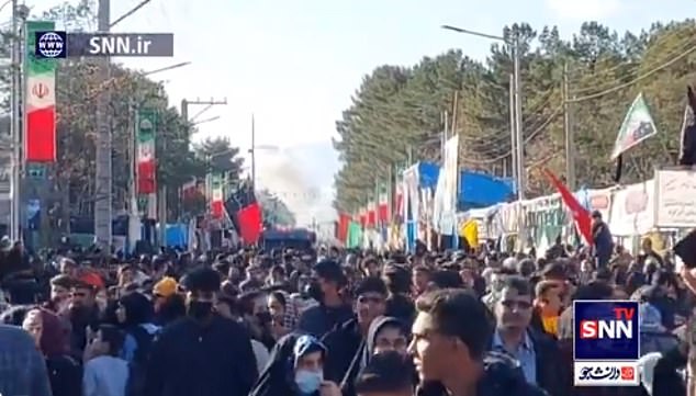 Video showed plumes of smoke rising into the air as thousands of people who had walked to the cemetery to mark Soleimani's killing screamed in horror