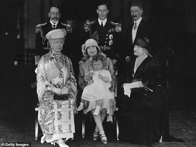 George V and Queen Mary, standing and sitting on the left, with their family.  Bertie, then Duke of York and later King George VI, takes center stage, with his wife, the Duchess of York, holding Princess Elizabeth.  The Duchess's parents, the Earl and Countess of Strathmore, are on the right.  The photo was taken on June 27, 1927, when the Yorks were reunited with their infant daughter after a six-month tour of Australia and New Zealand.