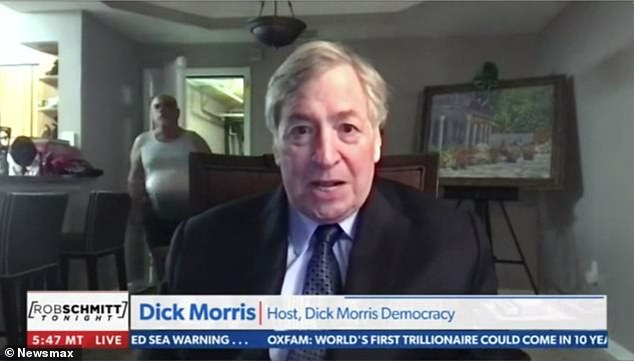 As commentator Dick Morris spoke to the camera, the man opened a door behind him - emerged from what appeared to be a large closet or garage - and walked out, without breaking stride.