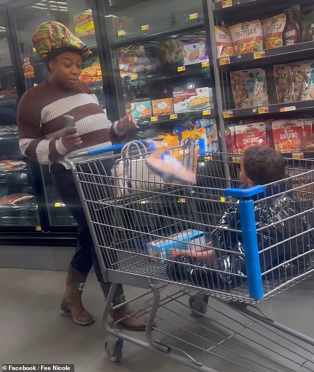 The mother (left) continued shopping as usual, throwing groceries into the cart next to her son