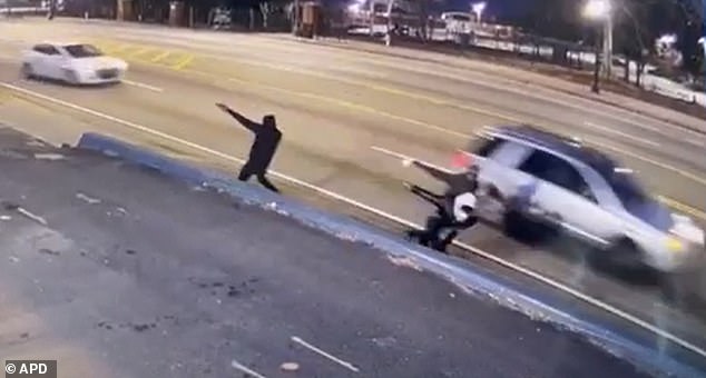 Three mysterious gunmen who chased and shot an 11-year-old boy along a busy Atlanta freeway two weeks ago are still at large