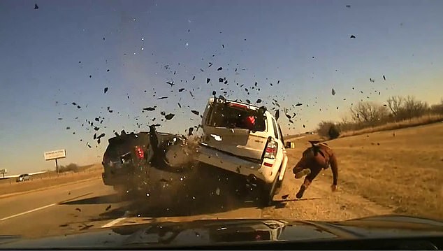 This is the horrifying moment an Oklahoma highway patrol officer is sent flying after a vehicle crashes into the car he had parked