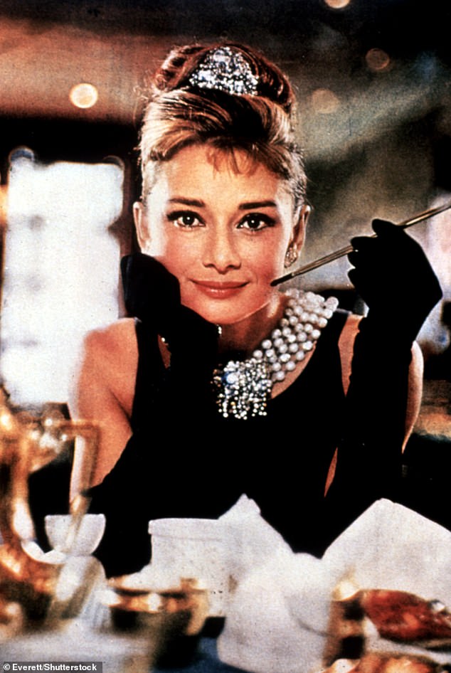 As the star of classics such as Breakfast at Tiffany's, Sabrina and Wait Until Dark, she was one of Hollywood's biggest film icons.  But as a little girl with no claim to fame, Audrey Hepburn was just a small part of a large household.  Above: Hepburn in Breakfast At Tiffany's