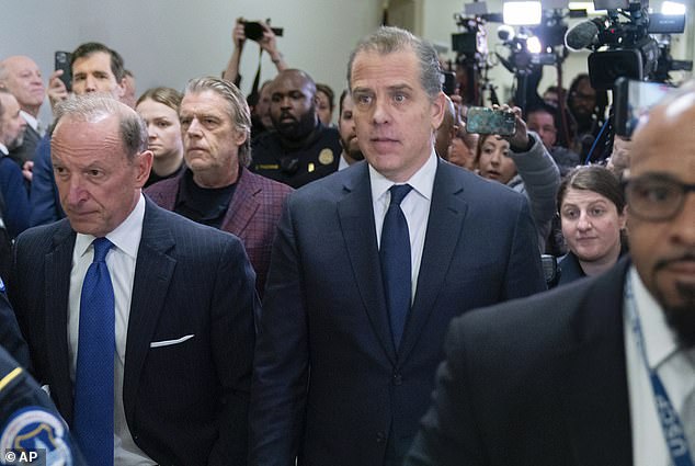 Hunter Biden, accompanied by his attorney Abbe Lowell, leaves a House Oversight Committee hearing as Republicans take the first step toward holding him in contempt of Congress, Wednesday on Capitol Hill in Washington, January 10, 2024