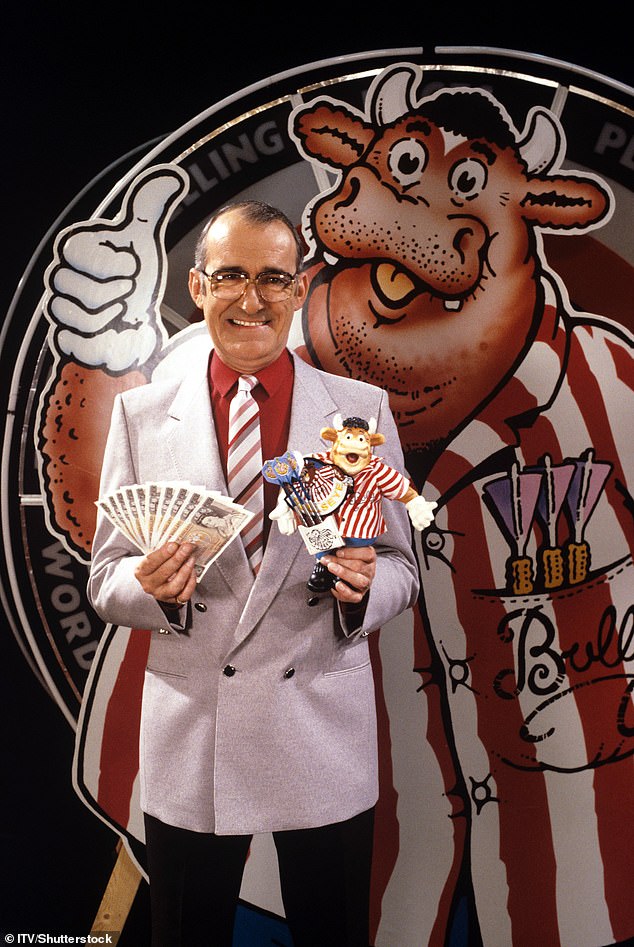 ITV bosses are considering bringing darts-themed game show Bullseye back to television screens after Luke Littler brought the nation back into the sport's grip, it is claimed (Jim Bowen was seen hosting Bullseye in 1984)