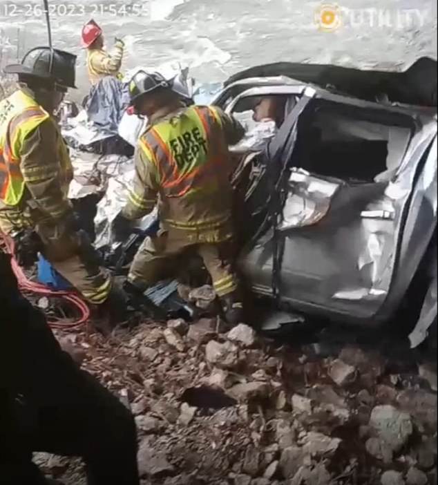 Matthew R. Reum, 27, (pictured in the crumpled car) was pulled to safety six days after he crashed off Interstate 94 in Portage, Indiana - with only rainwater to survive on during his plight