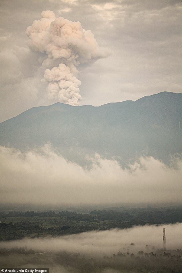 Mount Marapi spews columns of volcanic ash during an eruption, seen from Tanah Datar District, West Sumatra, Indonesia on January 13, 2024