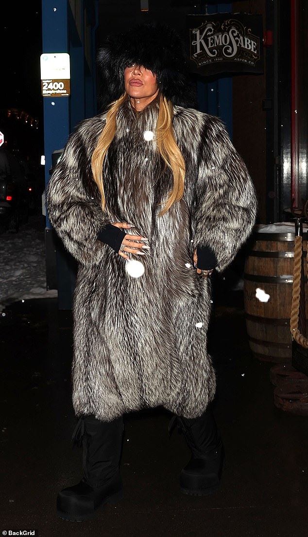 The 39-year-old former PETA associate wore a furry black bucket hat as she braved the cold