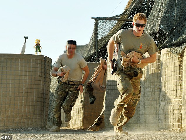 Captain Wales, as he was known in the British Army, races out of the VHR (very high readiness) tent to clamber his Apache along with fellow pilots