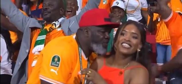 An interaction between a man and a woman among Ivory Coast fans has gone viral