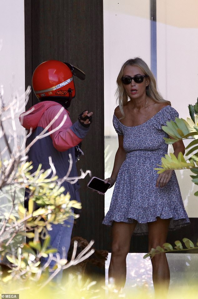 Jackie O Henderson appeared to have a tense exchange with a delivery driver as he delivered a food order to her Sydney mansion on Thursday