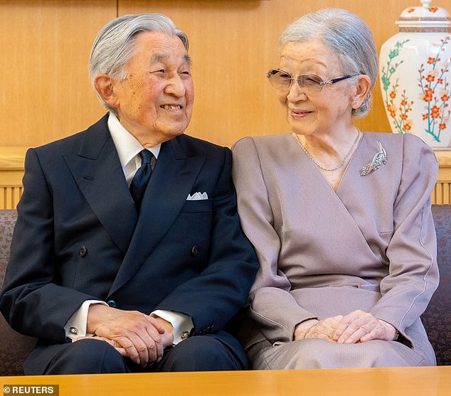 Former Japanese Emperor Akihito and former Empress Michiko appeared cheerful during a New Year's family photo session at their Tokyo residence