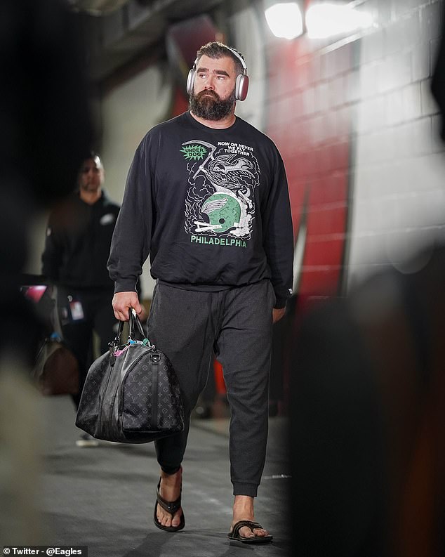 Philadelphia Eagles center Jason Kelce is dressed in a black team-issued sweatshirt and a leather bag and arrived at Raymond James Stadium in Tampa for Monday night's playoff game.