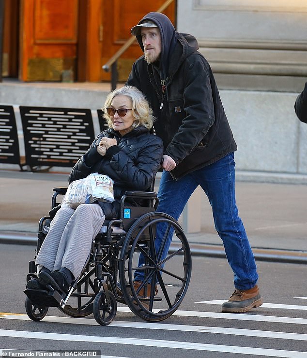 Jessica Lange was spotted on a rare outing with her son Samuel when he took her for a walk in her wheelchair in New York City on Friday