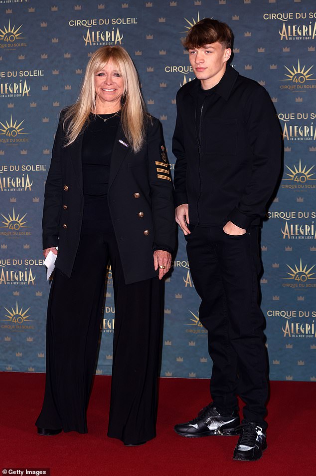 Jo Wood turned heads as she stepped out at London's Royal Albert Hall on Wednesday for the premiere of Cirque du Soleil's Alegria: In A New Light with her GB boxer grandson