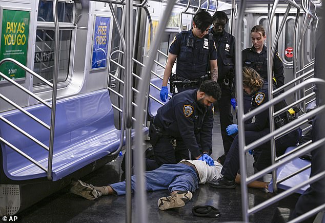 Police officers perform CPR on Jordan Neely on a train on May 1, 2023