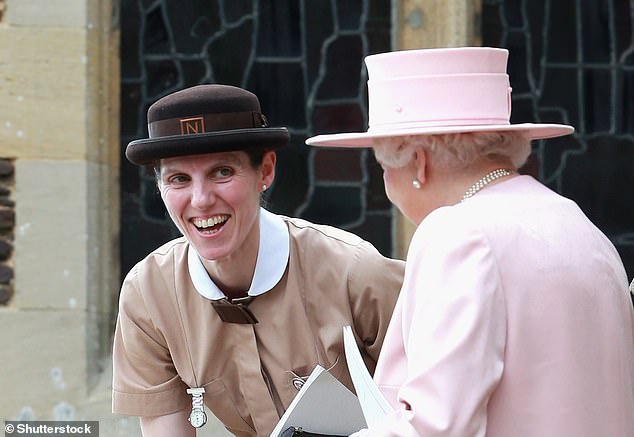 Nanny Maria Teresa Turrion Borrallo (in her Norland Nanny uniform) talking to the late Queen during Princess Charlotte's christening in July 2015