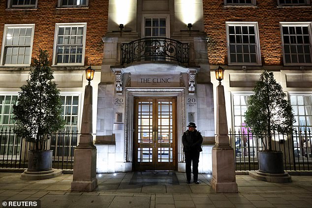 A police officer stands outside the London Clinic today, where Britain's Catherine, Princess of Wales, is in hospital for abdominal surgery