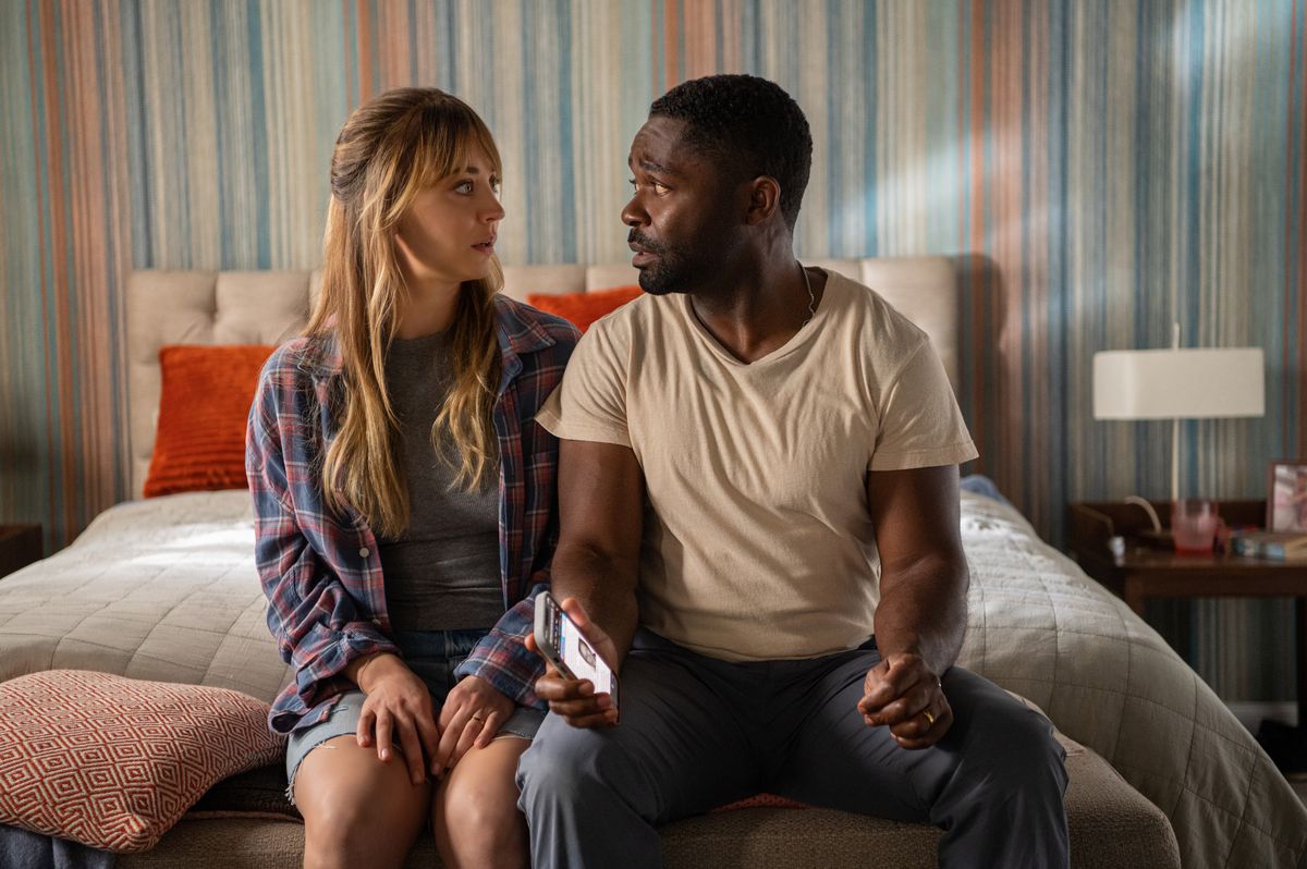 (L-R) Kaley Cuoco and David Oyelowo sit on a bed with visibly worried looks in Role Play.