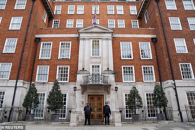 SATURDAY: Police officers stand outside the London Clinic where Charles is being treated