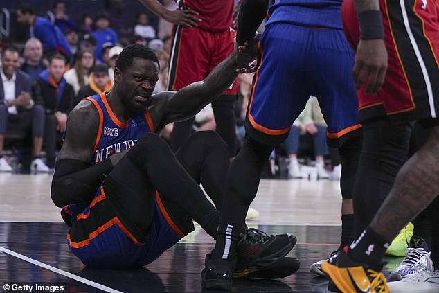 Julius Randle #30 of the New York Knicks reacts after an injury against the Miami Heat