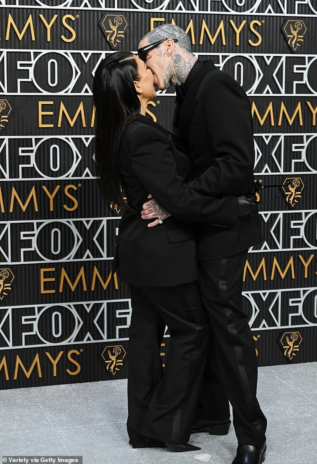 Kourtney Kardashian and husband Travis Barker packed on the PDA during the 2024 as she attended her first public event since welcoming their son, Rocky Thirteen, on November 1