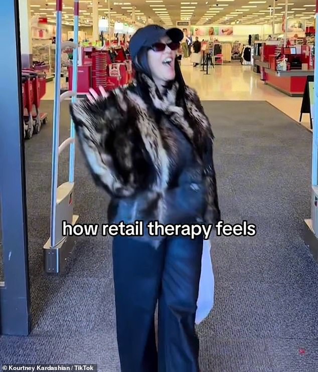 Kourtney Kardashian, 44, camouflaged her post-baby body in a fur coat and straight-leg pants while making a Target run in a new video shared to TikTok