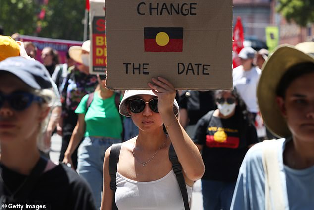 “I can't believe I have to thank everyone for allowing us to use the land, but we can't celebrate it on a national holiday,” Sandilands raged.  (Image: Woman holding a 'Change The Date' sign during an Invasion Day protest on January 26, 2023)