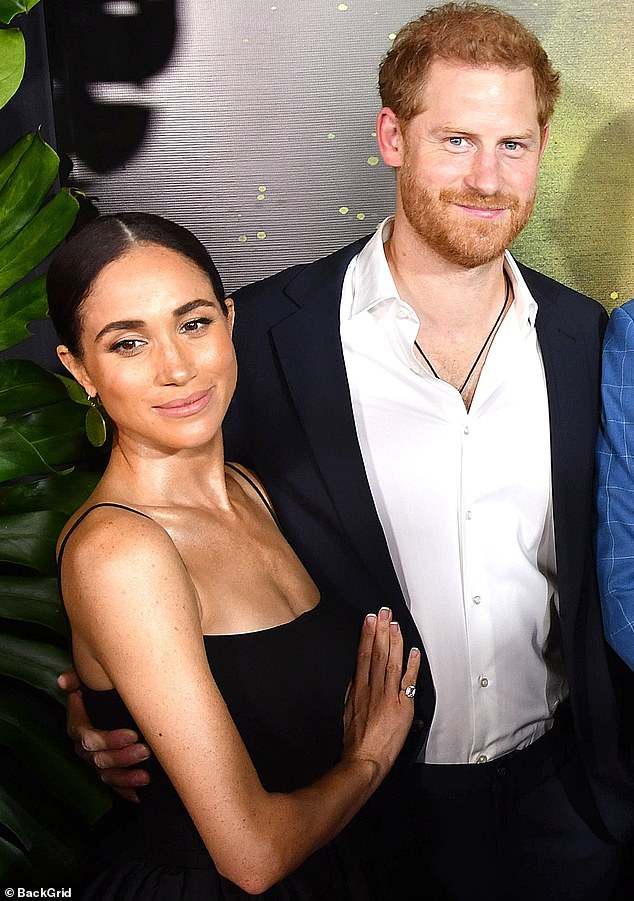 Like the vast majority of people in this country, I welcomed Meghan Markle into the royal family, writes LIZ JONES.  Pictured are the couple in Kingston, Jamaica, this week