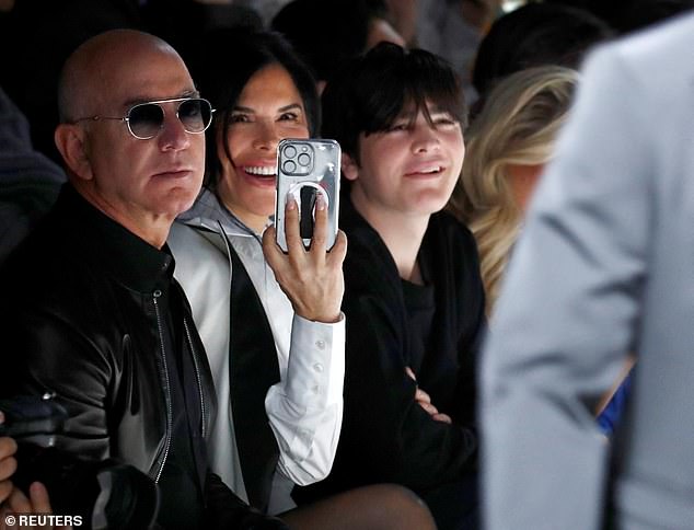 She couldn't wipe the smile off her face as her son walked past her and her Amazon billionaire fiance Jeff Bezos