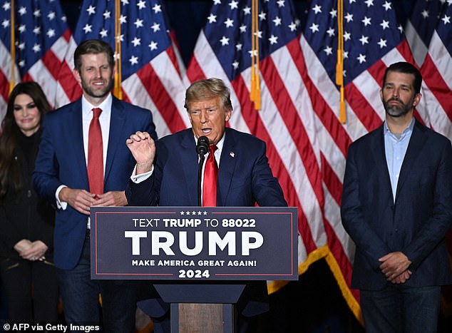 Donald Trump, highlighted by sons Eric (left) and Don Jr (right), easily won the Iowa caucuses