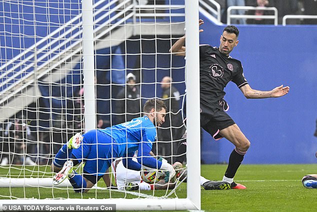 Dallas goalkeeper Maarten Paas (left) produced a great save to deny Messi (not in the shot) and then prevented Sergio Busquets from tapping in the rebound