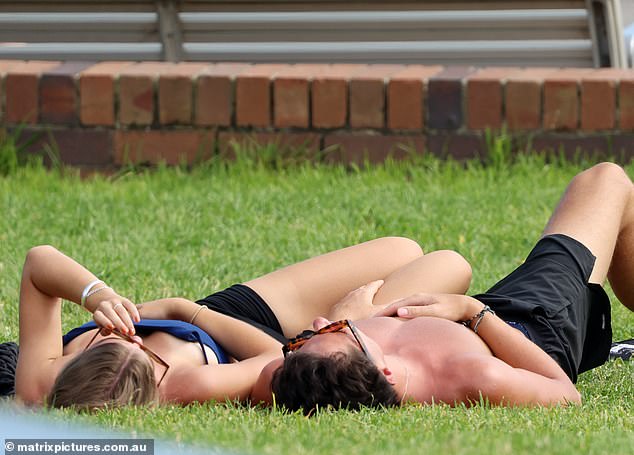 Finally, the pair lay down on the grass to catch some rays