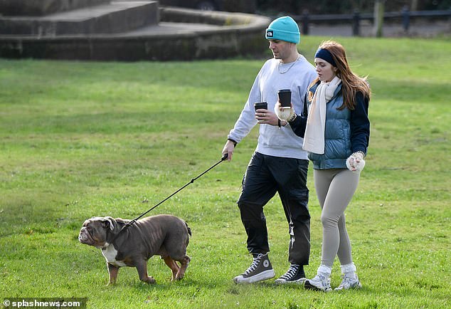 The Eastenders star, 22, looked simply chic in skintight gym leggings and a blue puffed waistcoat as she strolled around the park with her boyfriend