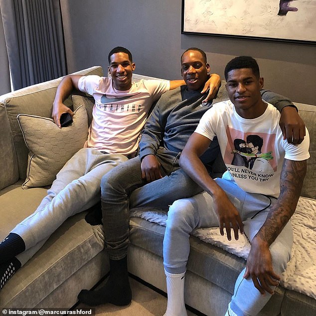 Dane Rashford (left) with brothers Dwaine Maynard and Marcus in an undated photo