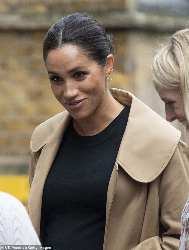 Pictured: Meghan Markle spotted wearing the pair of £1,990 diamond earrings while visiting Smart Works headquarters in January 2019