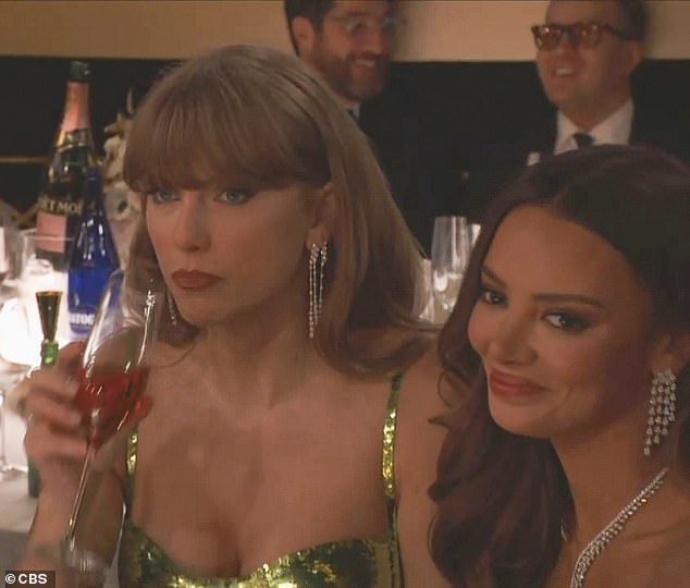 Taylor Swift looked decidedly unimpressed after she became the butt of one of Golden Globes host Koy's jokes on Sunday night